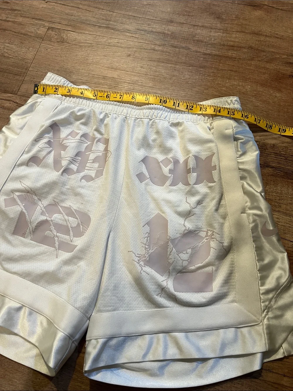 Nike Men’s White Athletic Shorts with Pale Pink Graphic